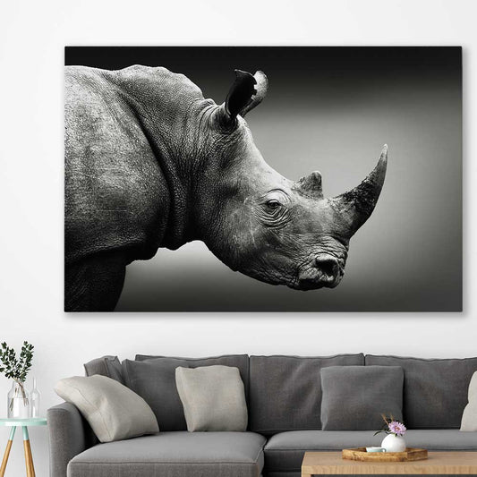 Animal wall art and canvas prints of Monochrome Rhinoceros on a stretched canvas displayed in a room