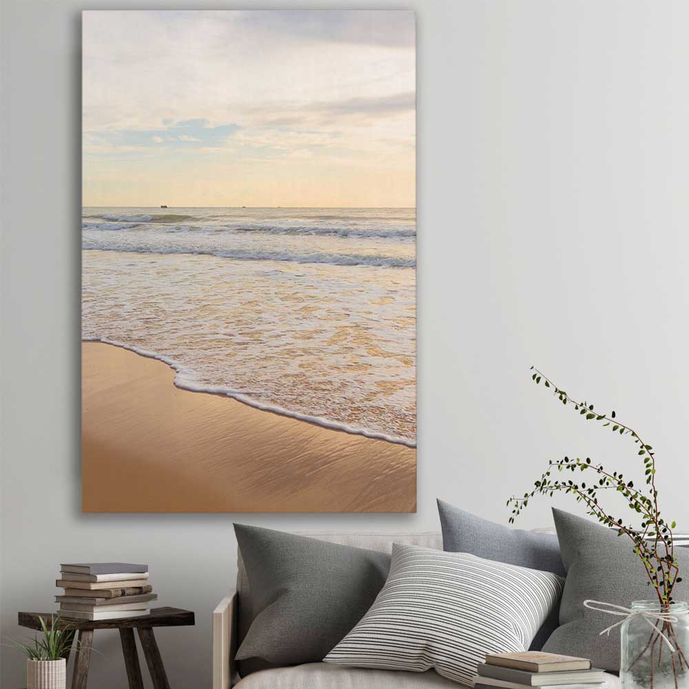 Beach and coastal wall art print of Gentle Tide on a stretched canvas displayed in a room