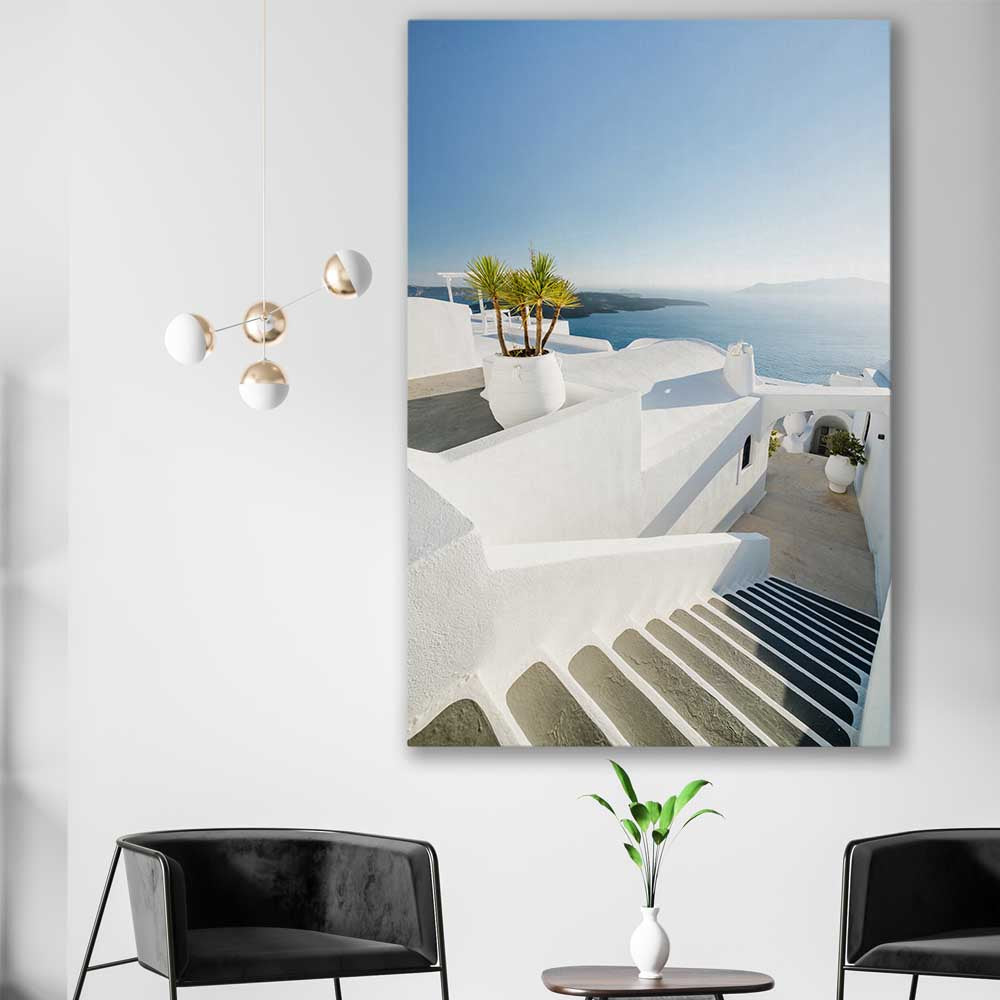 Beach and coastal wall art print of Santorini Walkway on a stretched canvas displayed in a room