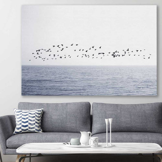 Beach and coastal wall art print of Seagull Flock on a stretched canvas displayed in a room