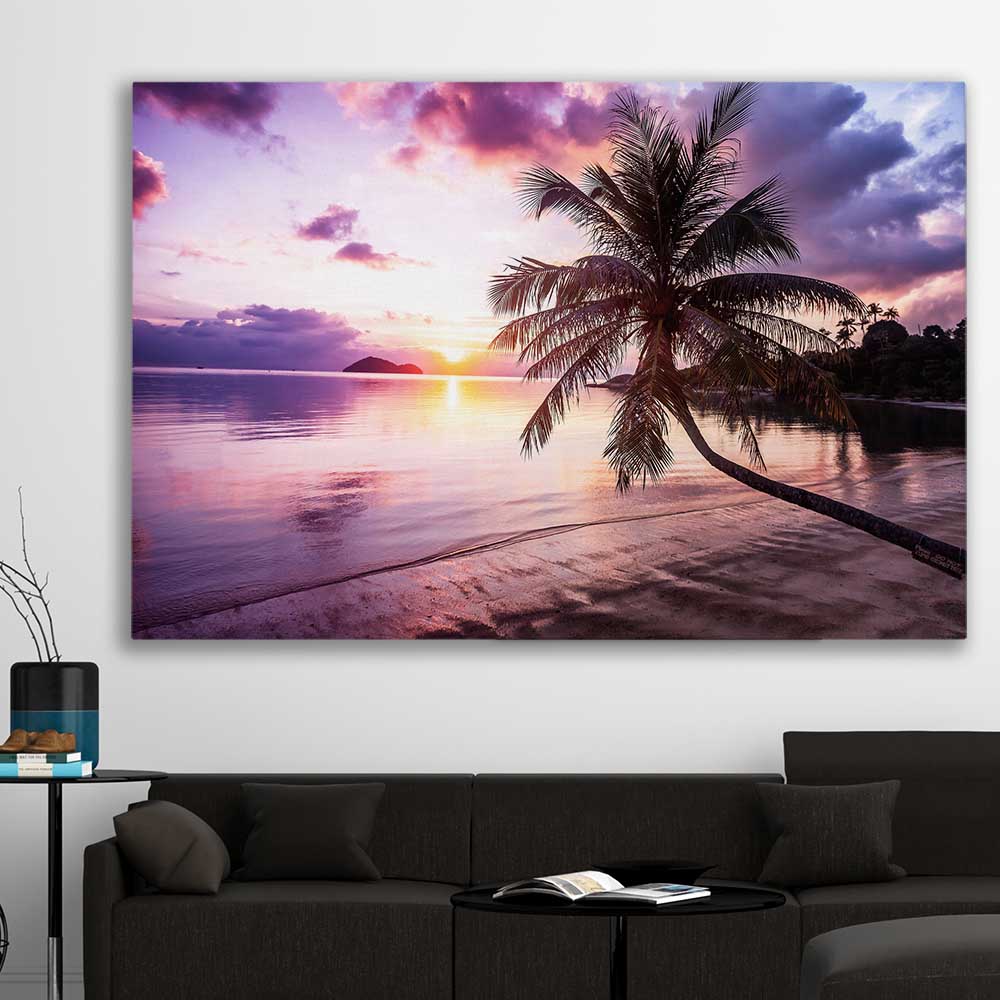 Beach and coastal wall art print of Tropical Sunset on a stretched canvas displayed in a room
