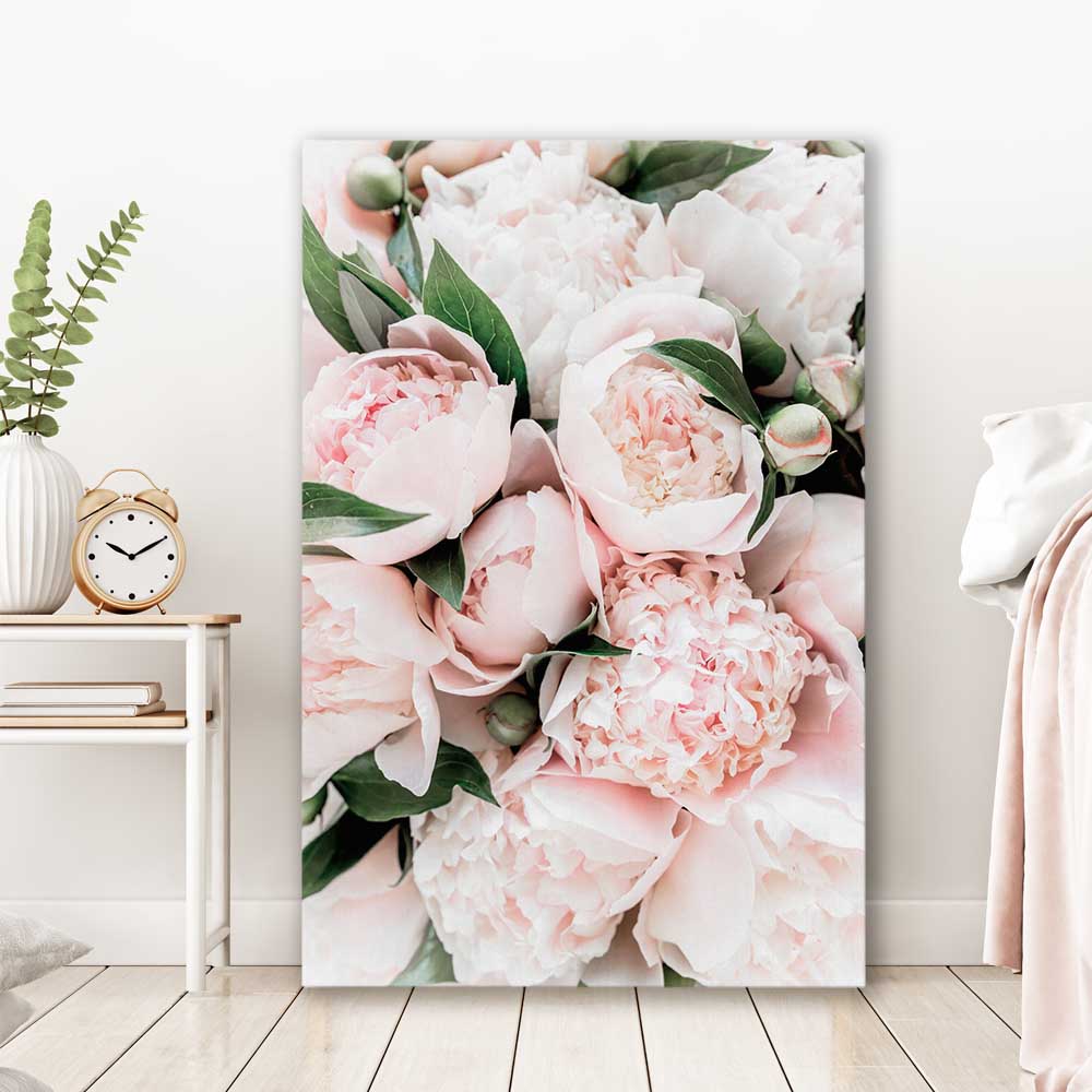 Floral print of Pink Peonies on a stretched canvas displayed in a room