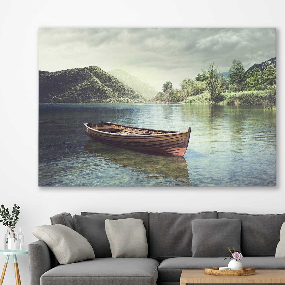 Floral print of Tranquil Wooden Boat on a stretched canvas displayed in a room