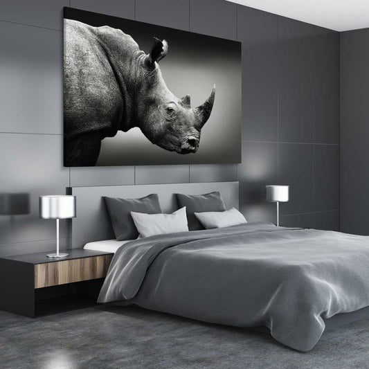 Animal wall art and canvas prints of Monochrome Rhinoceros on a stretched canvas displayed from an angle in a room