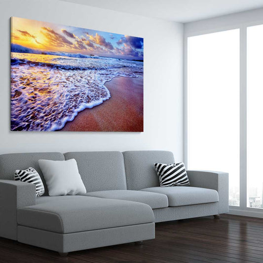 Beach and coastal wall art print of Sunset Coastal Glow on a stretched canvas displayed from an angle in a room