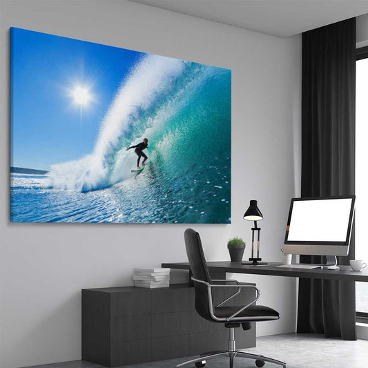 Beach and coastal wall art print of Blue Ocean Surfer on a stretched canvas displayed from an angle in a room