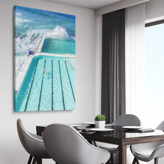 Beach and coastal wall art print of Bondi Iceberg on a stretched canvas displayed from an angle in a room