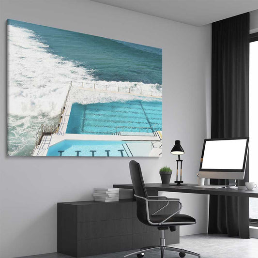 Beach and coastal wall art print of Bondi Iceberg Tide on a stretched canvas displayed from an angle in a room
