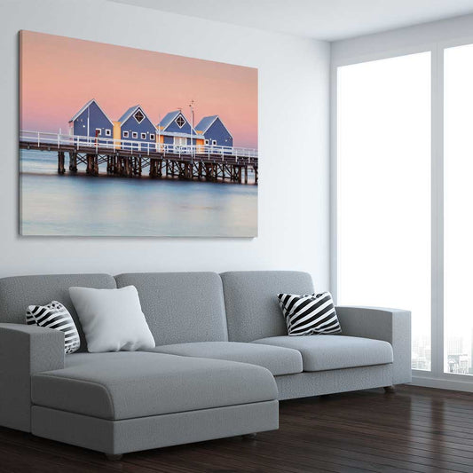 Beach and coastal wall art print of Busselton Jetty on a stretched canvas displayed from an angle in a room