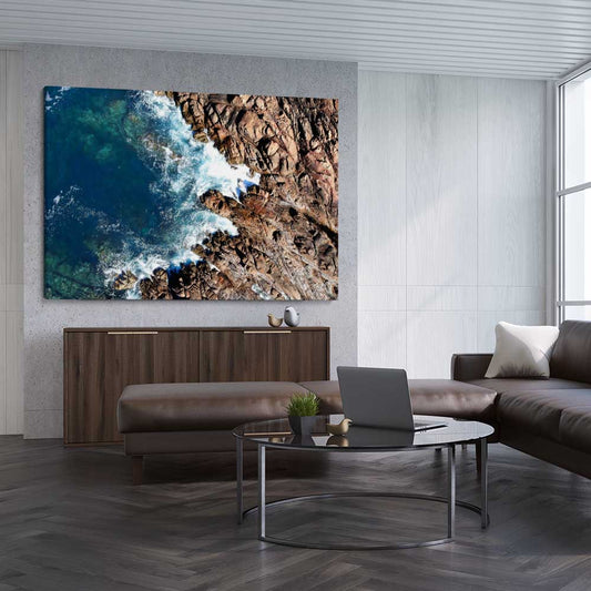 Beach and coastal wall art print of Canal Rocks One on a stretched canvas displayed from an angle in a room
