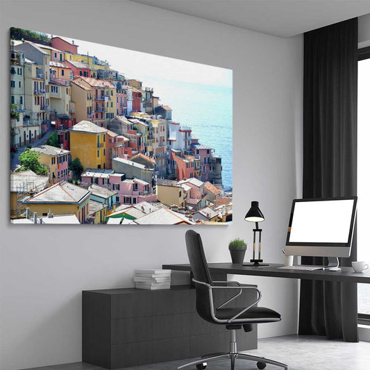 Beach and coastal wall art print of Cinque Terre on a stretched canvas displayed from an angle in a room