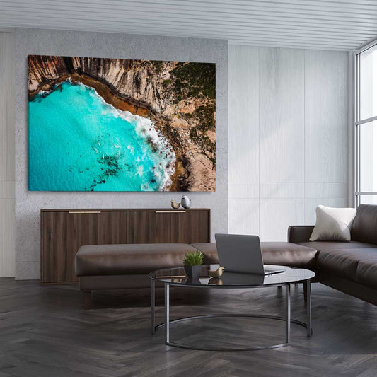 Beach and coastal wall art print of Crystal Clear Tides on a stretched canvas displayed from an angle in a room