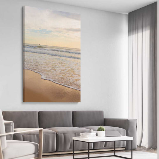 Beach and coastal wall art print of Gentle Tide on a stretched canvas displayed from an angle in a room
