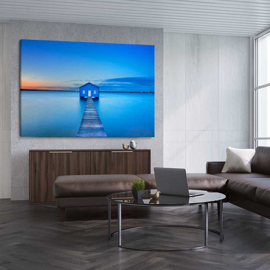 Beach and coastal wall art print of Matilda Bay Boathouse on a stretched canvas displayed from an angle in a room