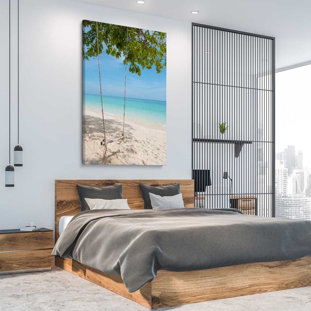 Beach and coastal wall art print of Pristine Beach Swing on a stretched canvas displayed from an angle in a room