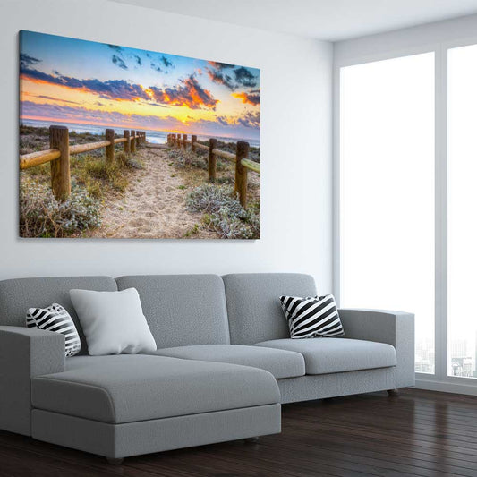Beach and coastal wall art print of Quiet Sunset Walk on a stretched canvas displayed from an angle in a room