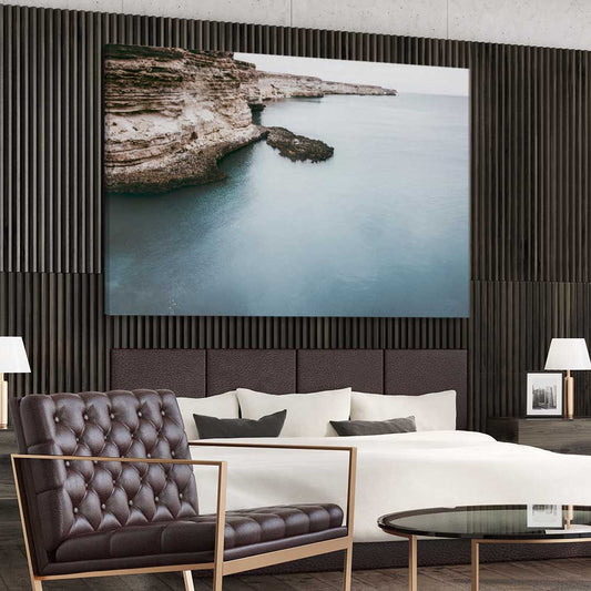 Beach and coastal wall art print of Quiet Waters on a stretched canvas displayed from an angle in a room