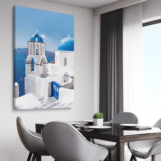 Beach and coastal wall art print of Santorini Dreaming on a stretched canvas displayed from an angle in a room