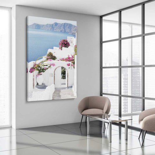 Beach and coastal wall art print of Santorini Island on a stretched canvas displayed from an angle in a room