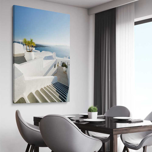 Beach and coastal wall art print of Santorini Walkway on a stretched canvas displayed from an angle in a room