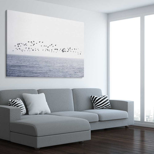 Beach and coastal wall art print of Seagull Flock on a stretched canvas displayed from an angle in a room