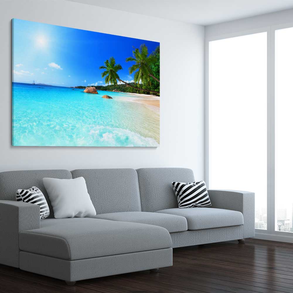 Beach and coastal wall art print of Seychelles Crystal Water on a stretched canvas displayed from an angle in a room