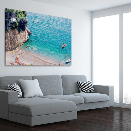 Beach and coastal wall art print of Turquoise Waters on a stretched canvas displayed from an angle in a room