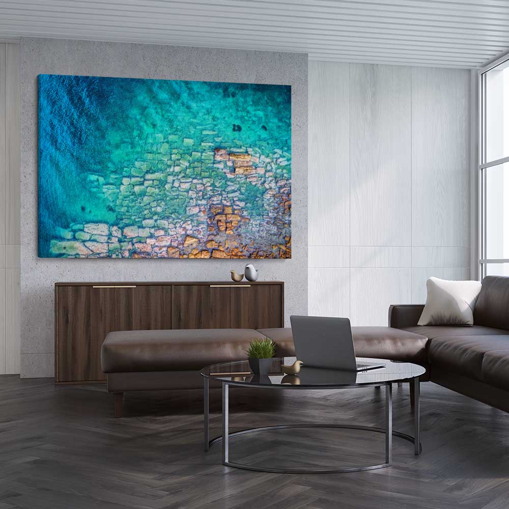 Beach and coastal wall art print of Watsons Bay Rocks on a stretched canvas displayed from an angle in a room