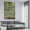 Classic wall art and canvas print of Water Lilies Pond Claude Monet on a stretched canvas displayed from an angle in a room