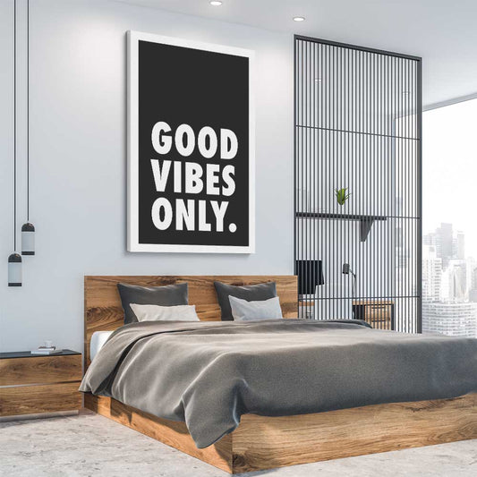 Inspirational wall art print of Good Vibes Only on a stretched canvas displayed from an angle in a room