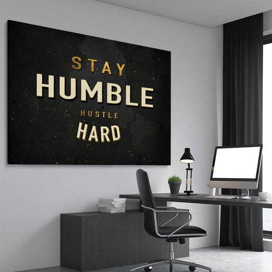 Inspirational wall art print of Stay Humble on a stretched canvas displayed from an angle in a room