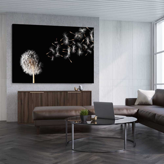 Floral print of Blowing Dandelion on a stretched canvas displayed from an angle in a room