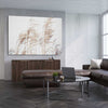 Floral print of Blowing Pampas on a stretched canvas displayed from an angle in a room