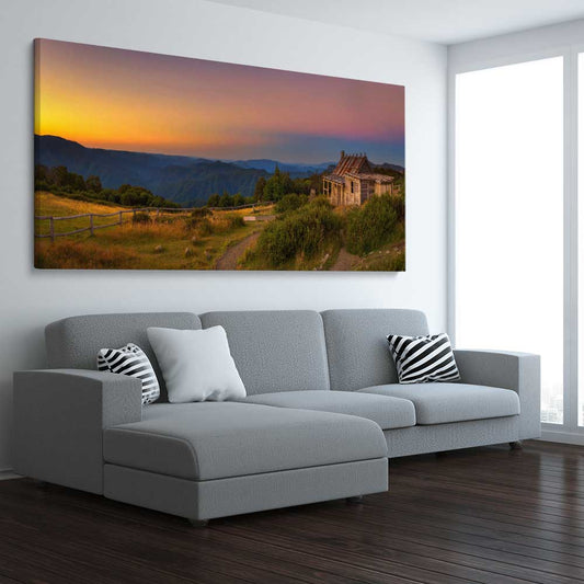 Floral print of Craigs Hut Victorian Alps on a stretched canvas displayed from an angle in a room