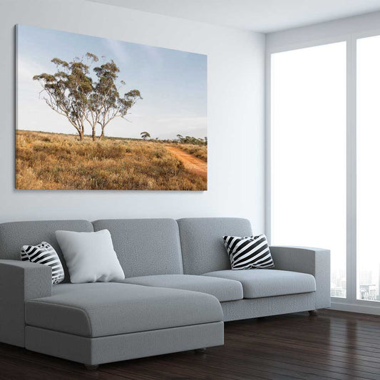 Floral print of Grassy Tufts on a stretched canvas displayed from an angle in a room