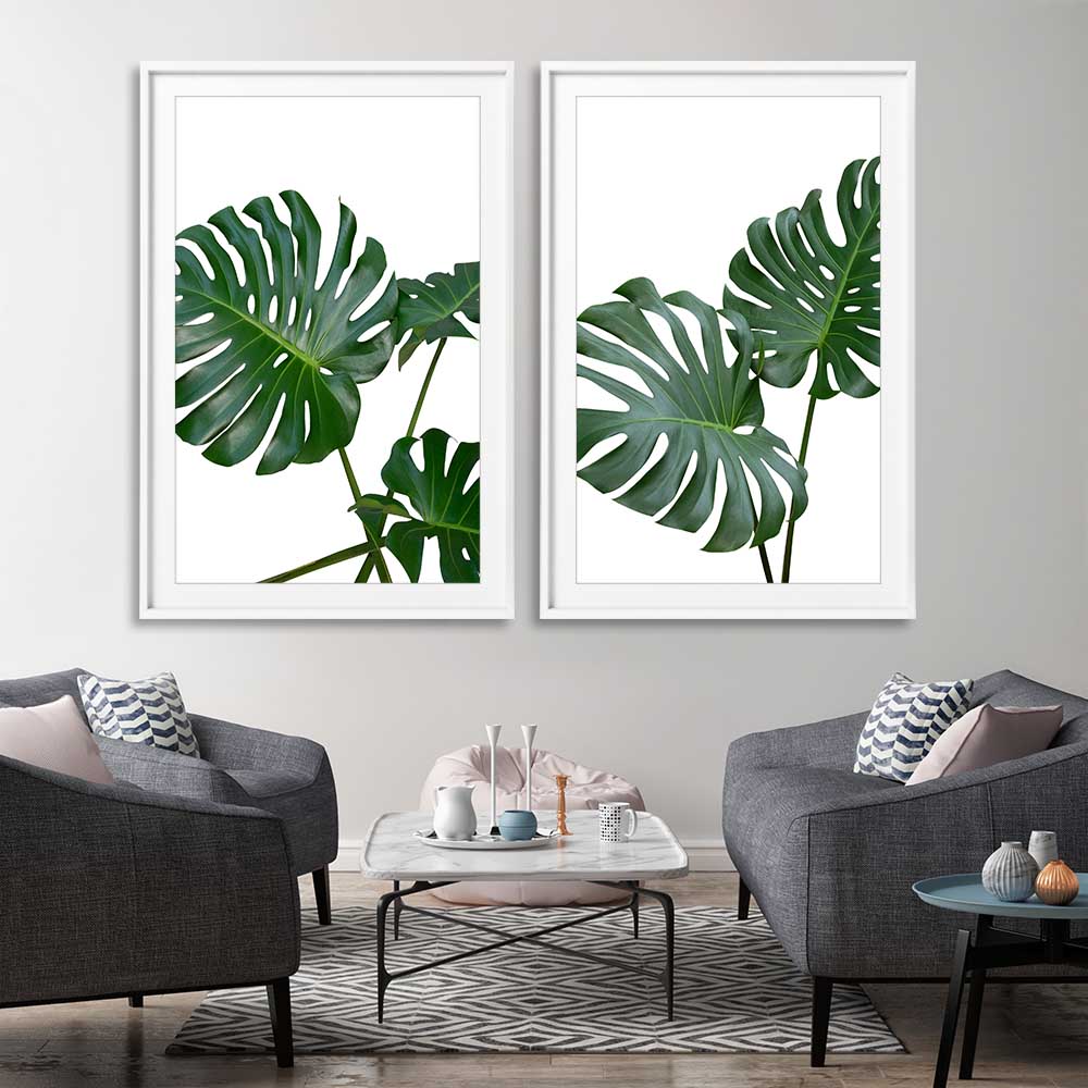 Floral print of Monstera Leaf Pair on a stretched canvas displayed from an angle in a room