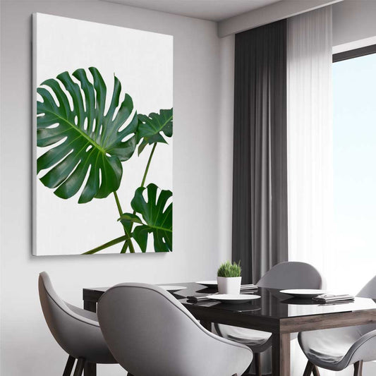 Floral print of Monstera Leaf Two on a stretched canvas displayed from an angle in a room