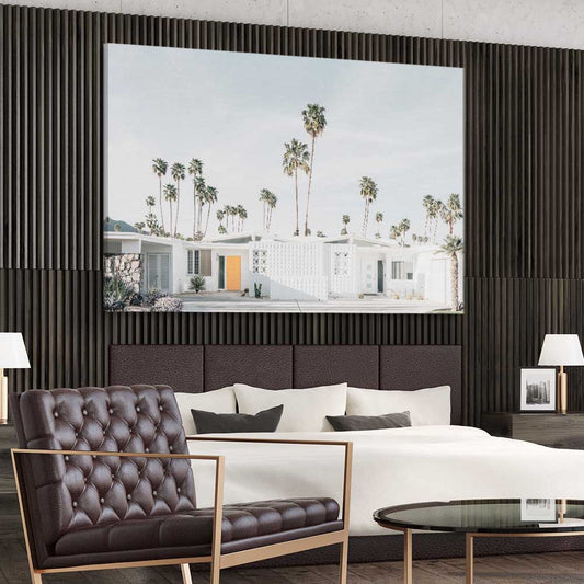 Floral print of Palm Springs on a stretched canvas displayed from an angle in a room