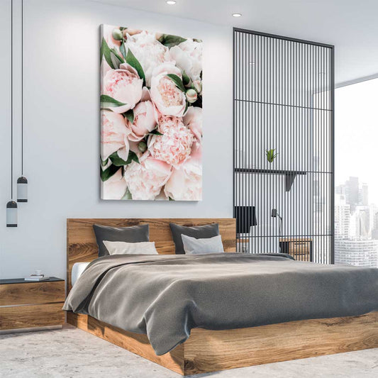 Floral print of Pink Peonies on a stretched canvas displayed from an angle in a room