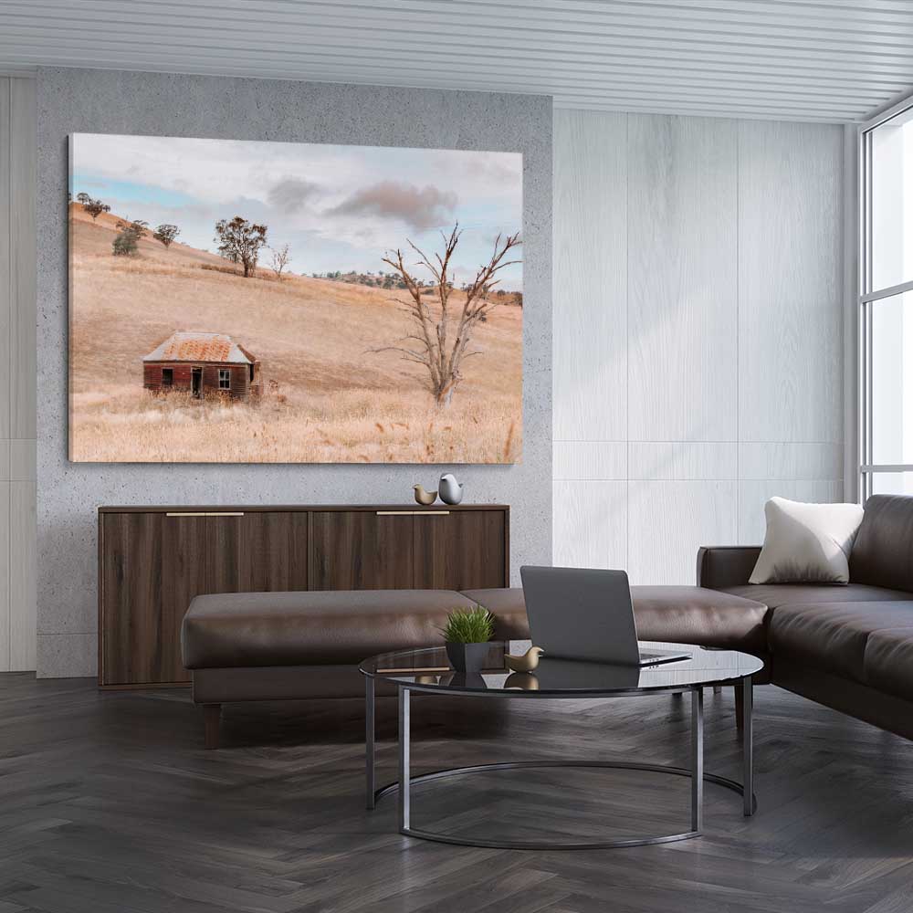 Floral print of Rural Farmhouse on a stretched canvas displayed from an angle in a room