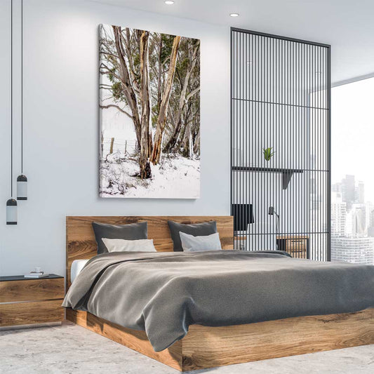 Floral print of Snowy Gumtrees on a stretched canvas displayed from an angle in a room