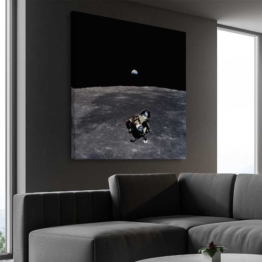 Space prints and wall art of Apollo 11 Earthrise on a stretched canvas displayed from an angle in a room