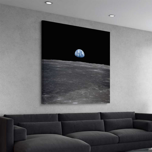 Space prints and wall art of Earthrise on a stretched canvas displayed from an angle in a room