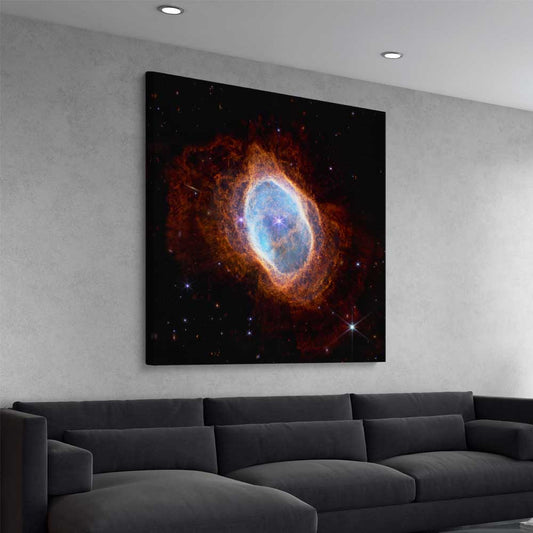 Space prints and wall art of Southern Ring Nebula on a stretched canvas displayed from an angle in a room