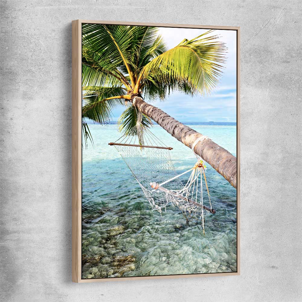 Beach and coastal wall art print of Maldives Hammock with raw oak framed canvas