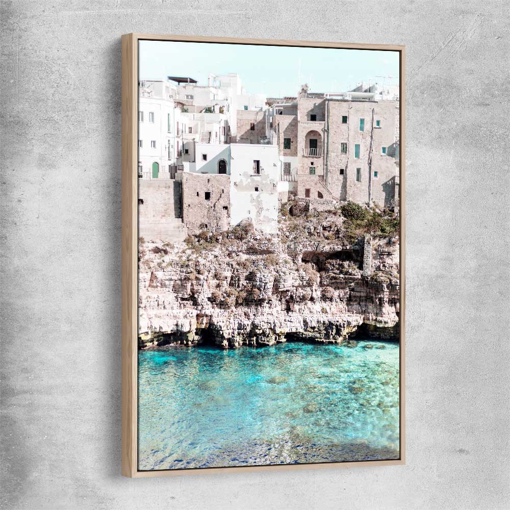 Beach and coastal wall art print of Polignano a Mare with raw oak framed canvas