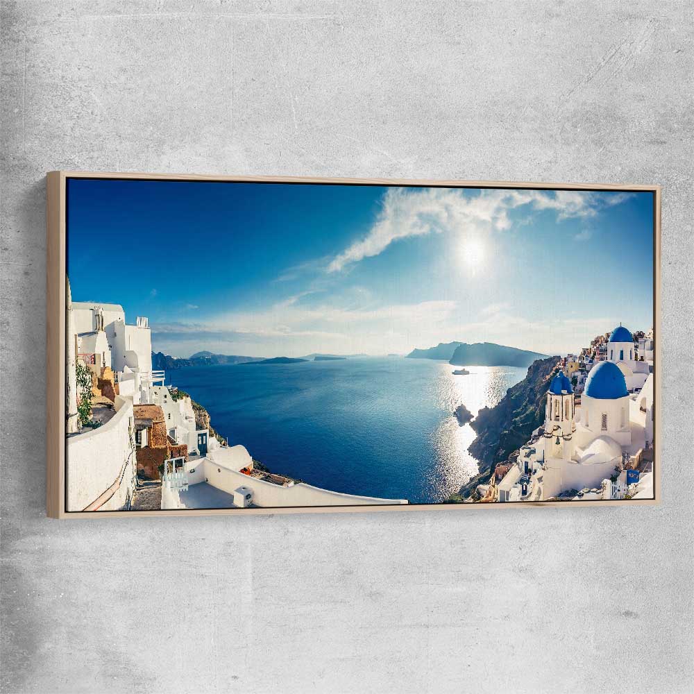 Beach and coastal wall art print of Santorini Panorama with raw oak framed canvas