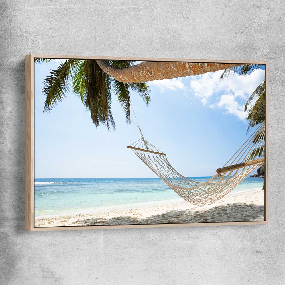 Beach and coastal wall art print of Seychelles Hammock with raw oak framed canvas