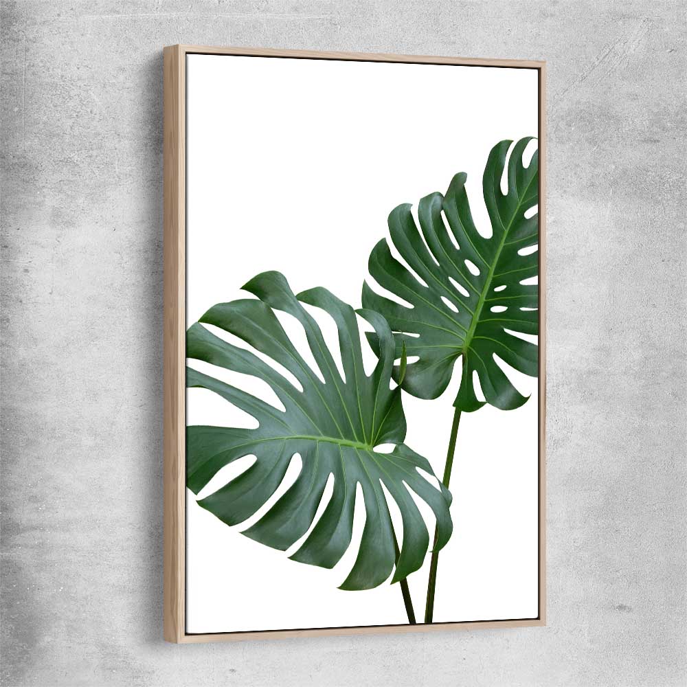 Floral print of Monstera Leaf One with raw oak framed canvas