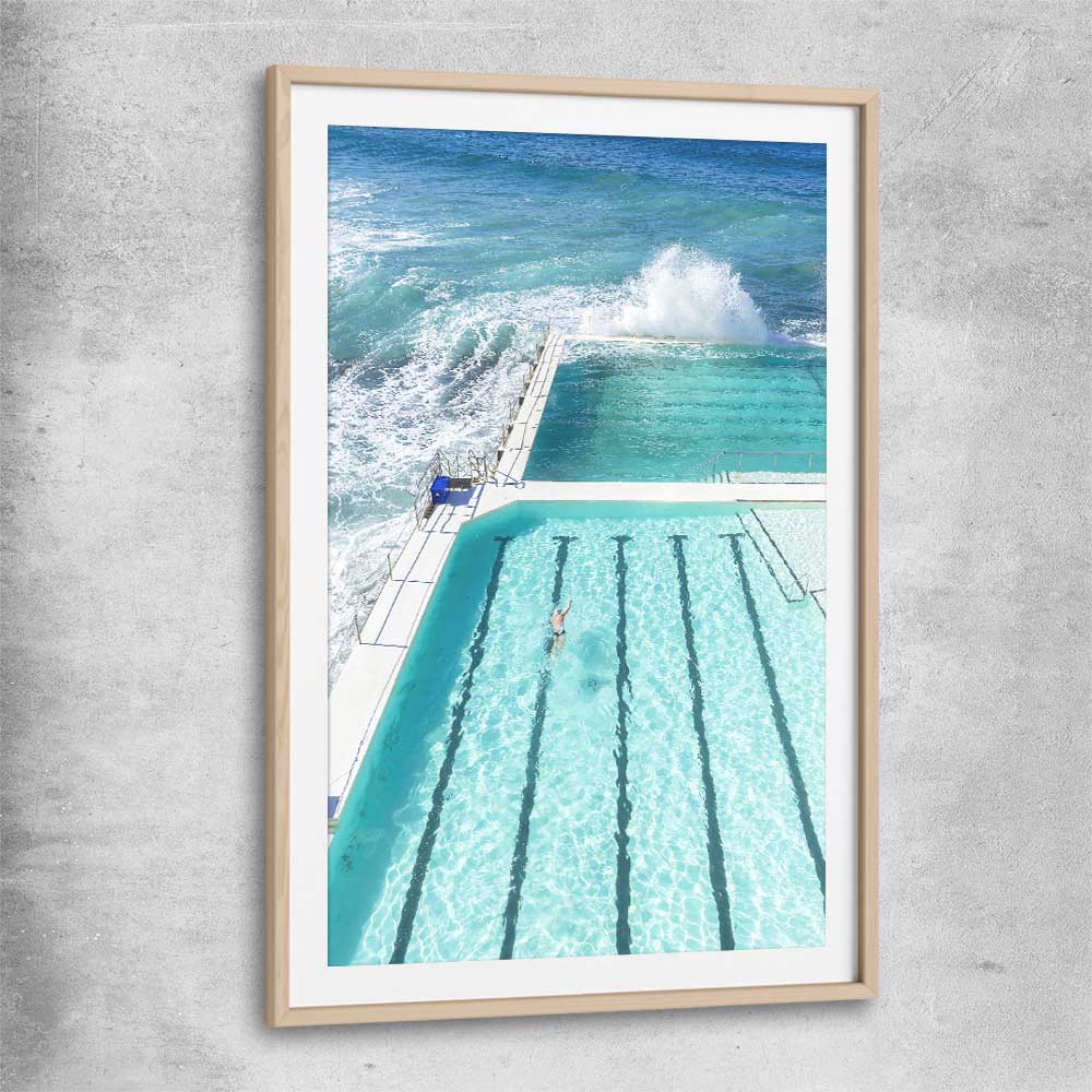 Beach and coastal wall art print of Bondi Iceberg with raw oak glass front frame
